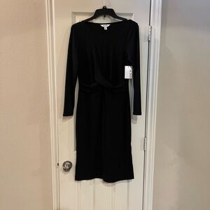 Black Nine West ribbed pattern midi dress. Twist front, slim fit styling.